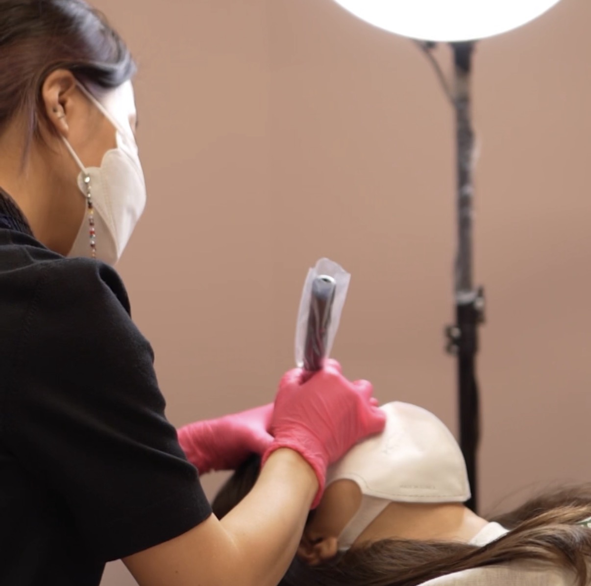 M Beauty — permanent makeup artist at work